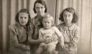 Elsie with her three children, (from L to R) Enid, Baden and Rita- about 1943.
