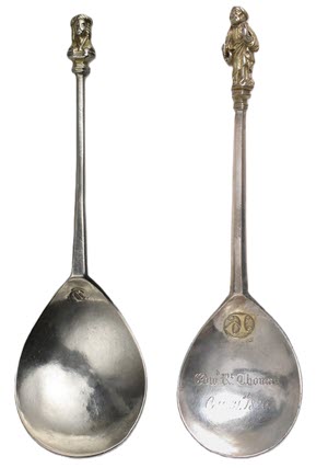 Two silver spoons, one with an engraving (unclear)