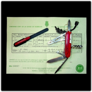 Swiss army knife with sharpener and birth certificate