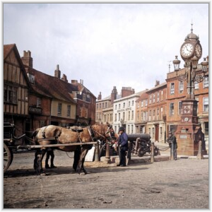 AI generated image. A bustling town square with horse-drawn carriage, men, a cannon, and a prominent clock tower.